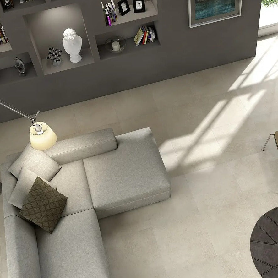 Stonework White matte porcelain tile with a stone design, for floors and walls. Made in Italy, installed in a room.