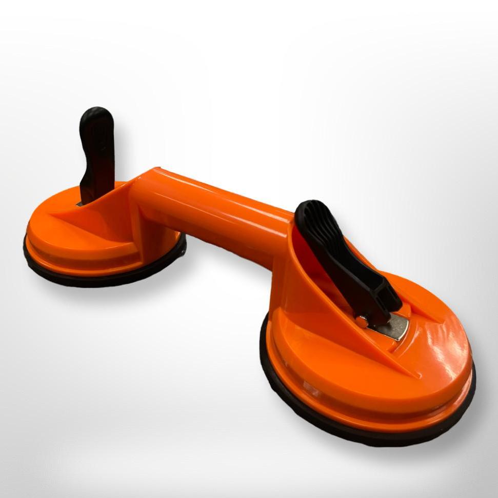 Orange colour double suction cups to be used for picking up tile, glass, stone, etc.