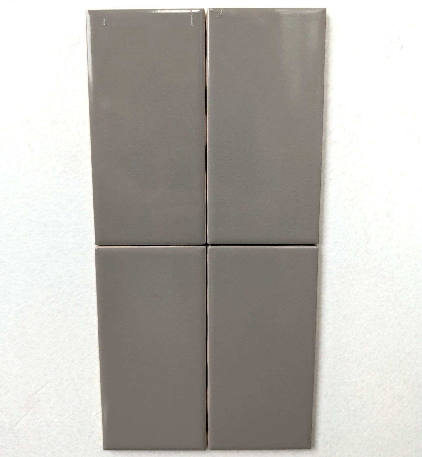 Taupe glossy ceramic subway tile for walls. In a 3x6" size.