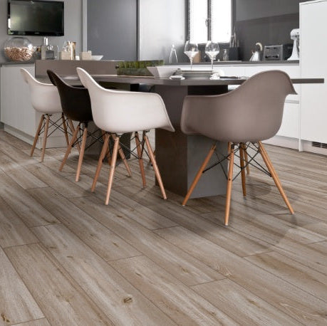 Travekheart Taupe matte porcelain tile with a wood design, for floors and walls. Made in Italy, installed in a room.