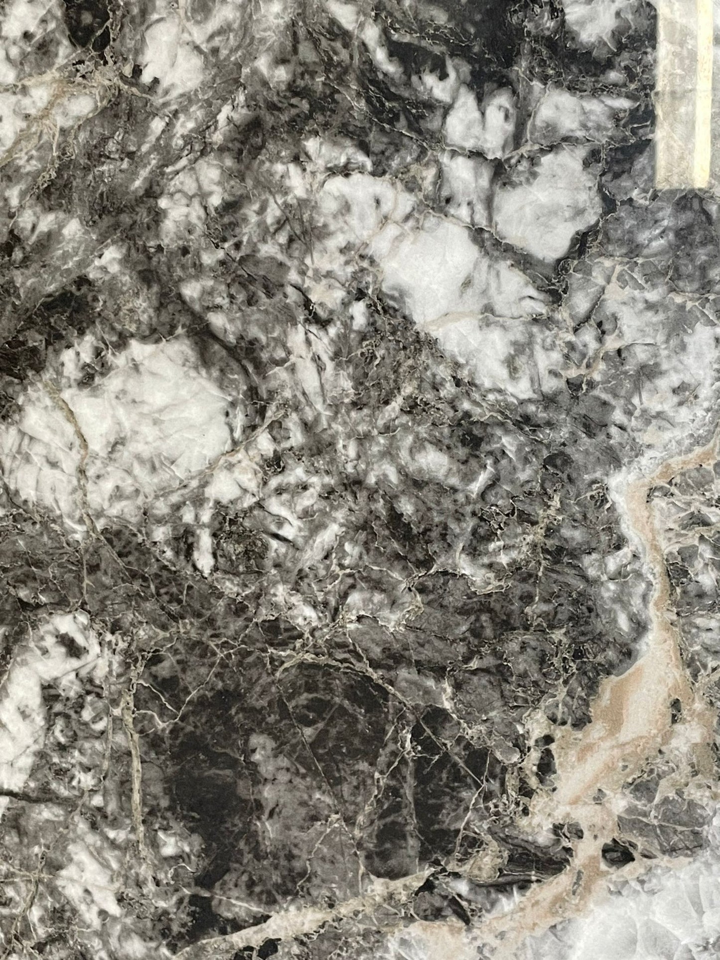 Twilight Canyon polished porcelain tile with a black and white marble effect, for floors and walls. A close up of the tile.