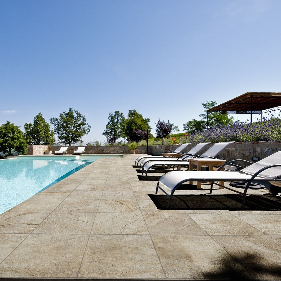 Utah Desert matte porcelain tile with a beige stone design, for floors and walls. Made in Italy, installed outside.