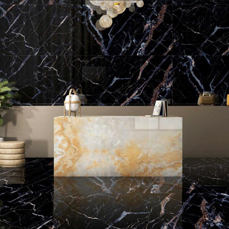 Van Gogh Blue polished porcelain tile with a black and blue marble design, for floors and walls. Installed in a room.