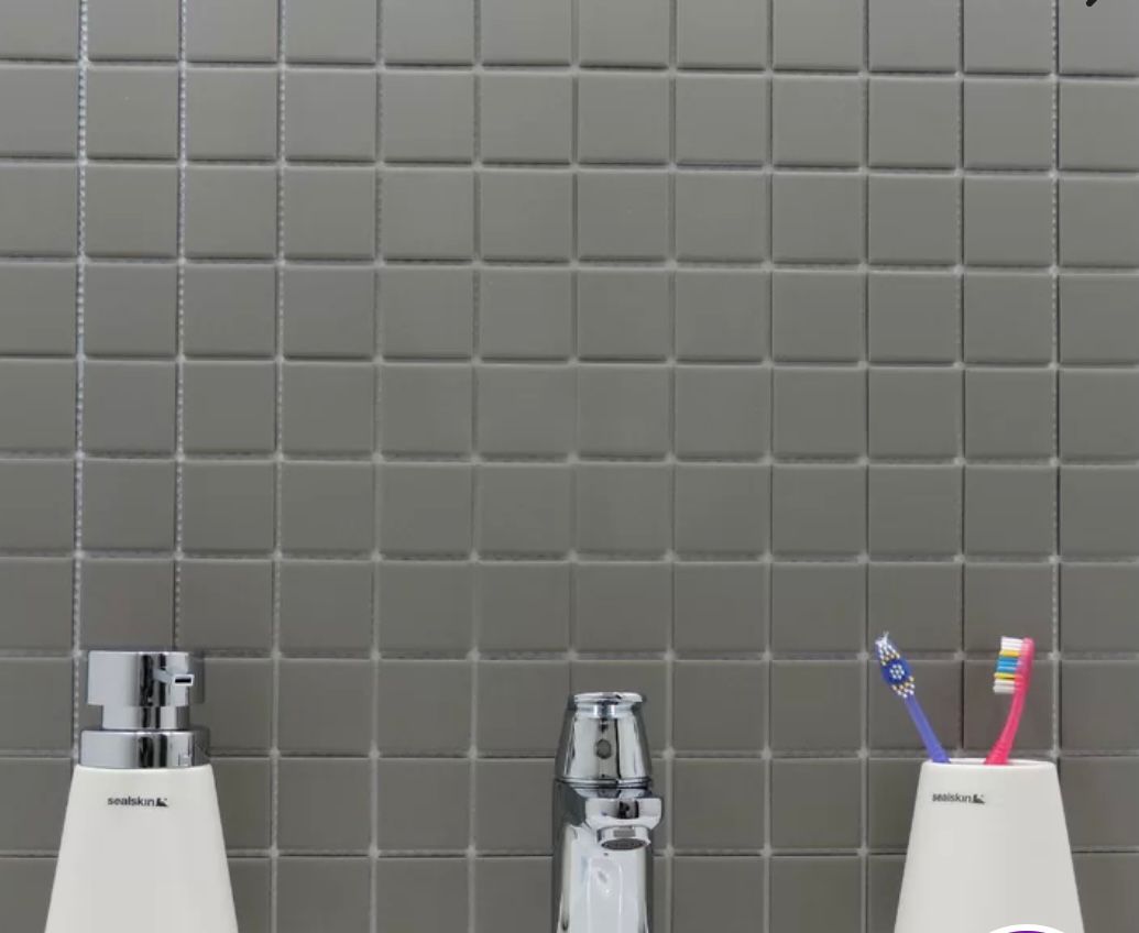 Vintage Dusk pure light grey square porcelain mosaic, for floors and walls. Installed on a vanity backsplash.