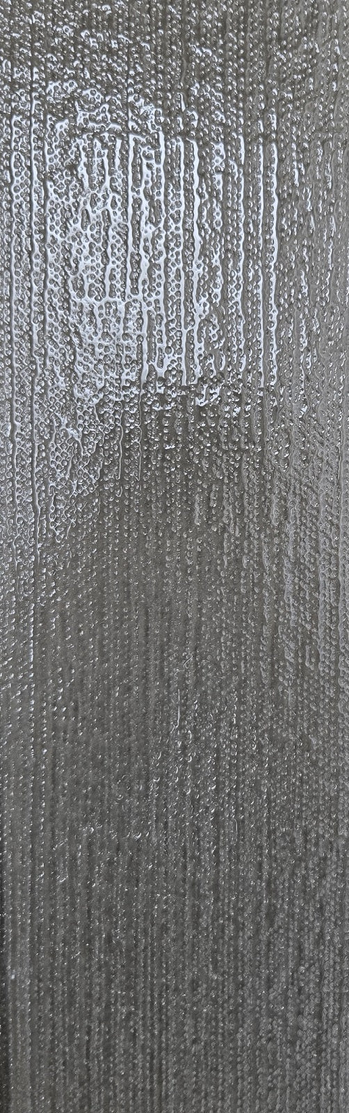 Wilderness Walk black/dark grey glass subway tile with a stucco finish. In a 4x12" size.