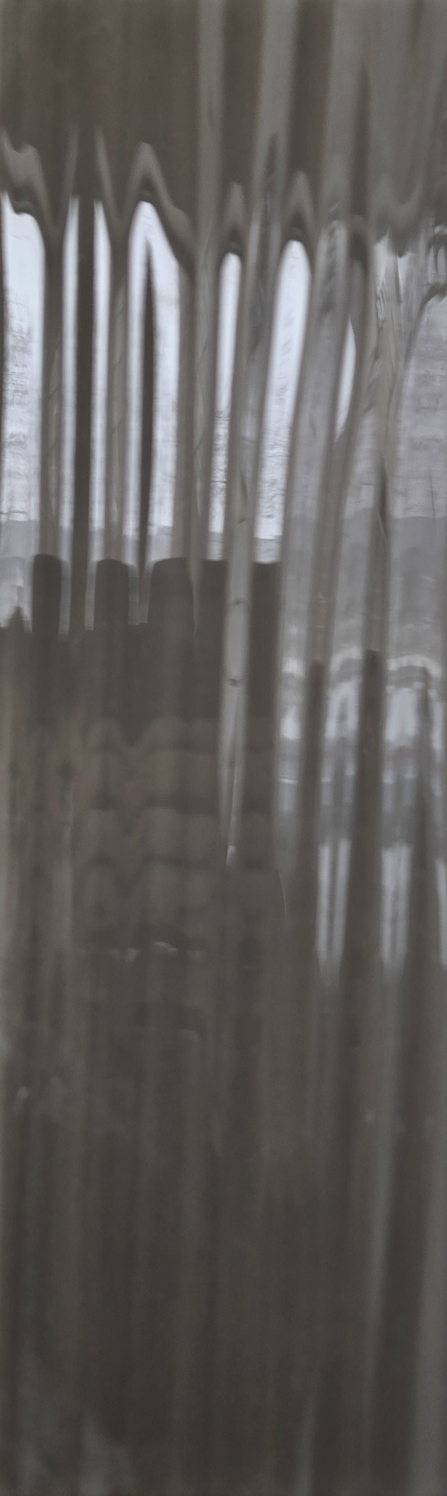 Wilderness Walk black/dark grey glass subway tile with a waved finish. In a 4x12" size.