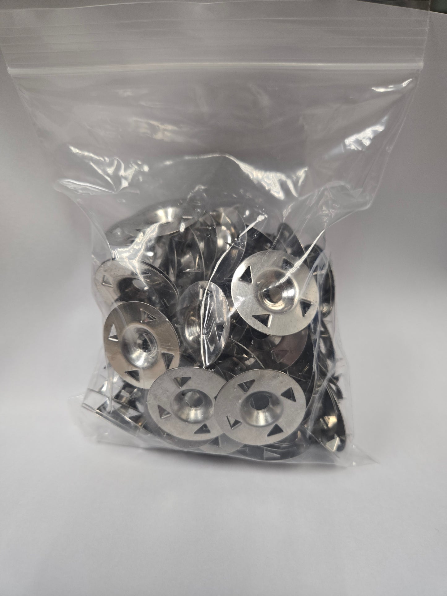 Bag of 100 washers for extruded polystyrene (XPS) foam tile backer boards.