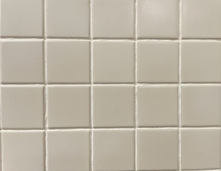 York Bone satin (matte) finish mosaic tile with a light cream colour, in a square shape.