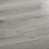 SPC Vinyl flooring in a natural grey wood look in a 7x48" size, installed on a floor.
