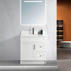 30 inch white MDF bathroom vanity with a carrara quartz top, a door and drawers, a chrome faucet, and black handles.