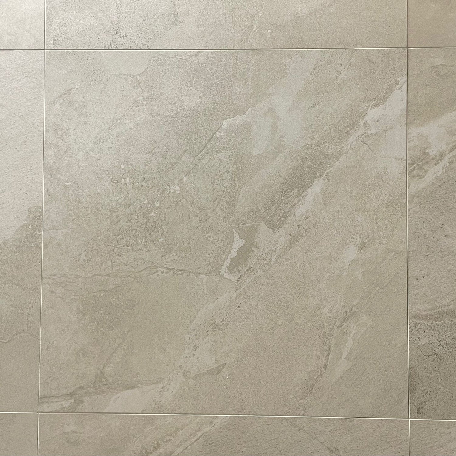 Alaska Glacier matte finish porcelain tile with a white stone design, for floors and walls. In a 24x24" size.