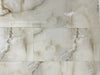 Anty Sky Ivory polished porcelain tile with a beige onyx design, for floors and walls. In a 12x24" size.