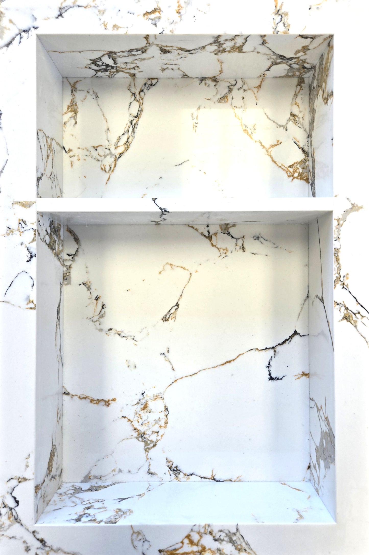 Arabescato Gold prebuilt quartz shower niche made of engineered stone that offers shower storage, with a shelf.
