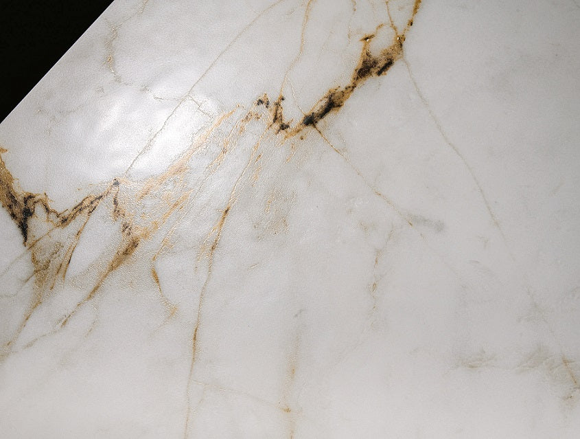 Barnaby lappato porcelain tile with a white, gold, and silver marble design, for floors and walls. In a 24x48" size.