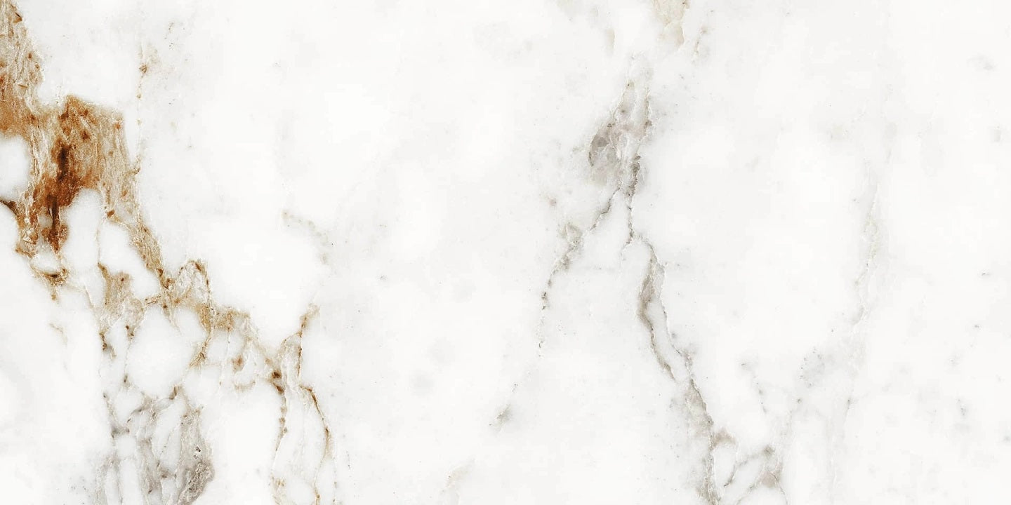 Barnaby matte porcelain tile with a white, gold, and silver marble design, for floors and walls. In a 24x48" size.
