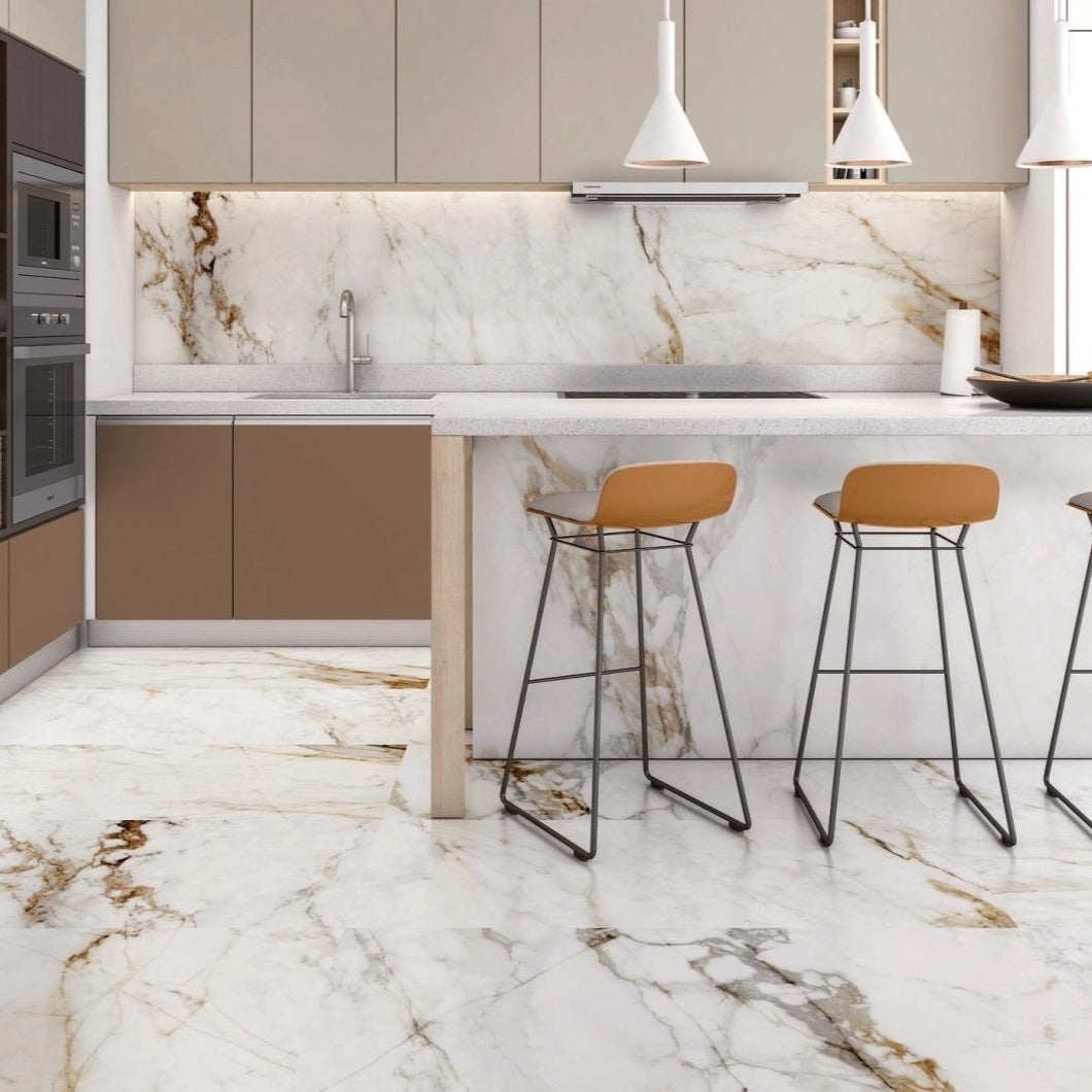 Barnaby porcelain tile with a white, gold, and silver marble design, for floors and walls. Installed in a kitchen.