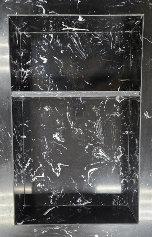 Black Marquina prebuilt quartz shower niche made of engineered stone that offers shower storage, with a shelf.