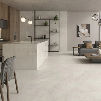 Caesars Beige polished porcelain tile with a beige quartzite design, for floors and walls. Installed in a room.