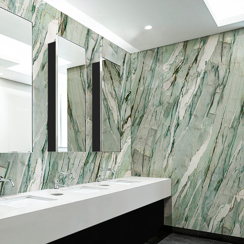 Calacatta Mint polished porcelain tile with a marble design, for floors and walls. Made in Italy, installed in a room.