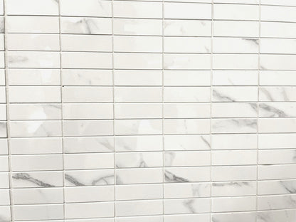 Carrara Royale polished porcelain tile in a white marble style, for floors and walls. In a rectangle mosaic size.