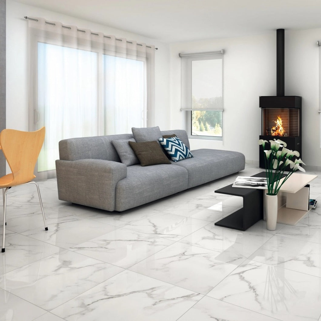 Casablanca porcelain tile with a white marble design, for floors and walls. Made in Spain, installed in a room.