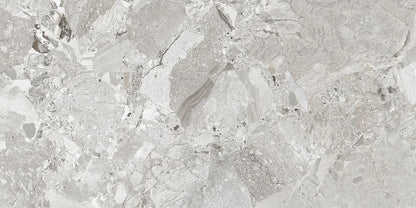 Ceppo White polished porcelain tile with a rock/pebble design, for floors and walls. Made in Spain, in a 24x48" size.