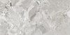 Ceppo White polished porcelain tile with a rock/pebble design, for floors and walls. Made in Spain, in a 24x48" size.