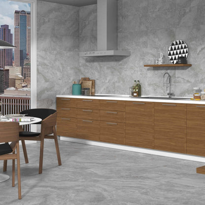 Cipriani Gris matte porcelain tile with a grey stone/cement design, for floors and walls. Installed in a room.