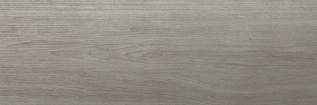 Corsica Argento matte ceramic tile with a grey wood design, for floors and walls. Made in Spain, in an 8x24" size.