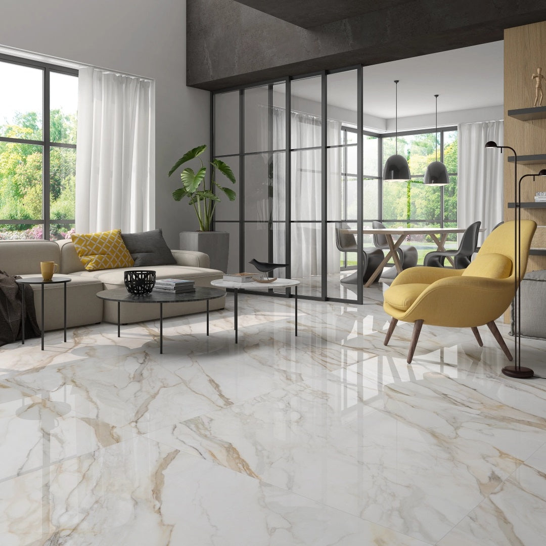 Dorian Gold polished porcelain tile with a gold marble design, for floors and walls. Made in Spain, installed in a room.