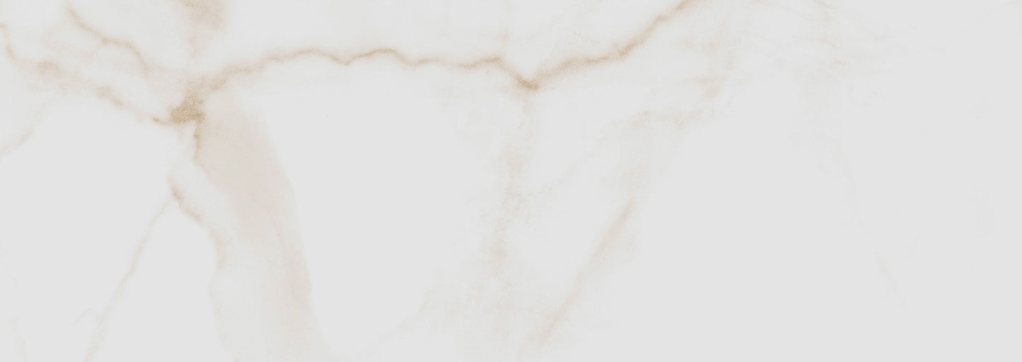 Essential Gold glossy ceramic tile with a white and gold marble design, for walls. Made in Spain, in a 10x28" size.