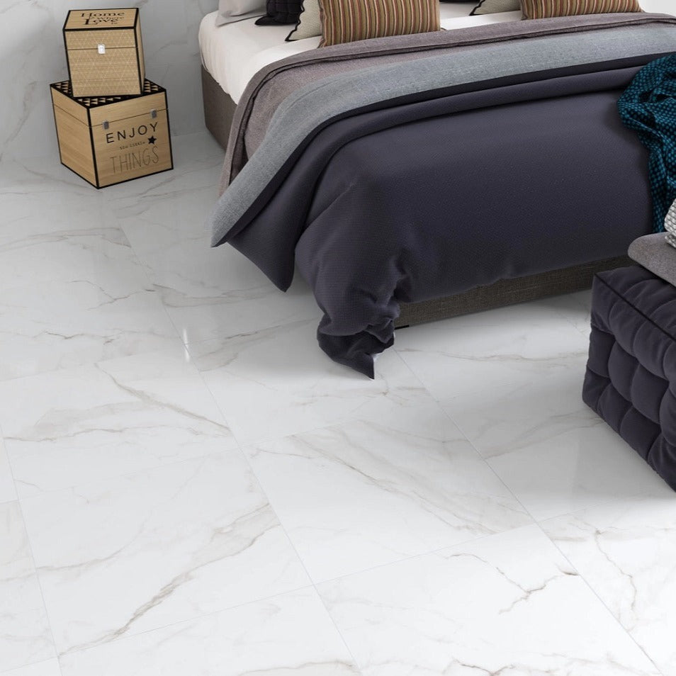 Essential White glossy porcelain tile with a white and grey marble design, for floors and walls. Installed in a room.