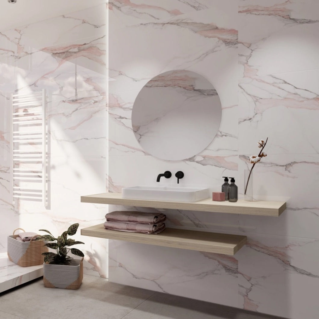 Fantasy Pink polished porcelain tile with a white marble design, for floors and walls. Installed in a bathroom.
