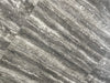 Ferrara Grey polished porcelain tile with a stone design, for floors and walls. In a 24x24" size.