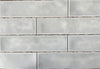 Fez White Spanish artisan style glossy ceramic subway tile with non-flat edges and surface, for walls. In a 3x12" size.