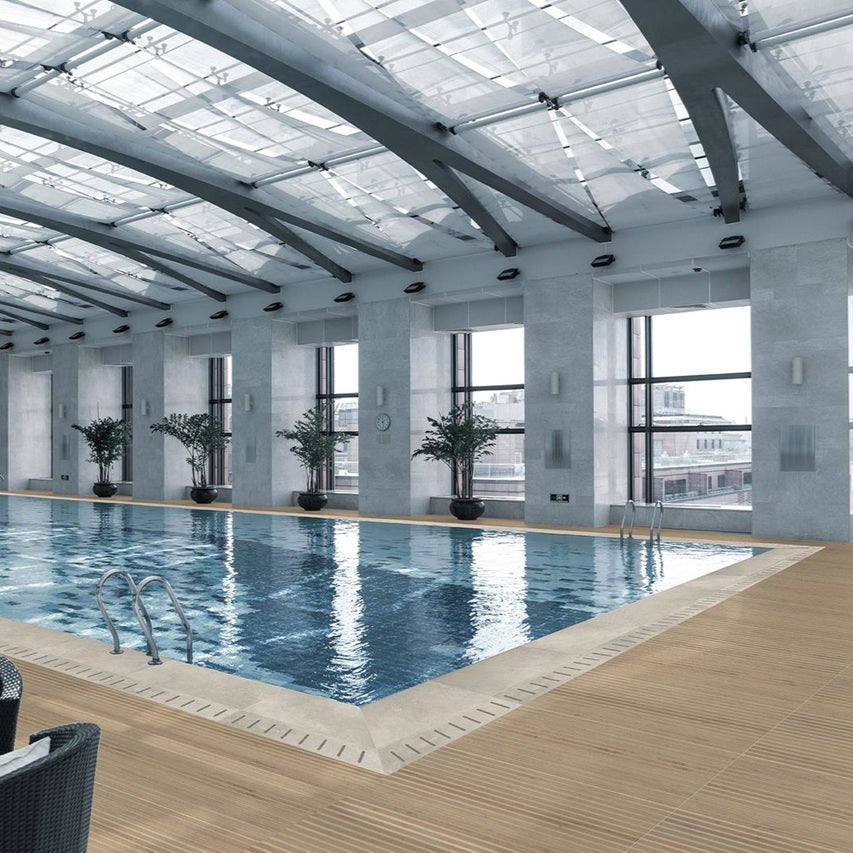 Frame Mid matte porcelain tile with a fluted wood design, for feature walls. Made in Italy, installed on a floor.