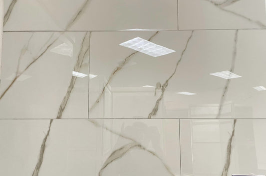 Golden Gioia polished porcelain tile with a white marble design, for floors and walls. In a 12x24" size.