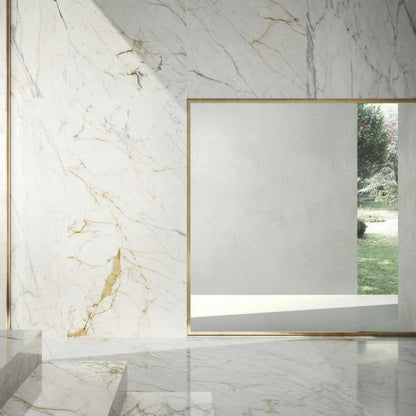 Golden White polished porcelain tile with a white marble design, for floors and walls. Made in Italy, installed in a room.