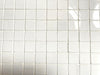 Imperial White polished porcelain tile with a pure white design, for floors and walls. In a 1x1" mosaic size.