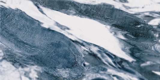 Lab Jeans Blue porcelain tile with a white marble design, for floors and walls. Made in Spain, in a 24x48" size.