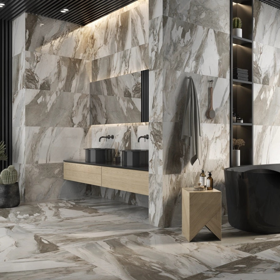 Lab Jeans Cream porcelain tile with a white marble design, for floors and walls. Made in Spain, installed in a room.