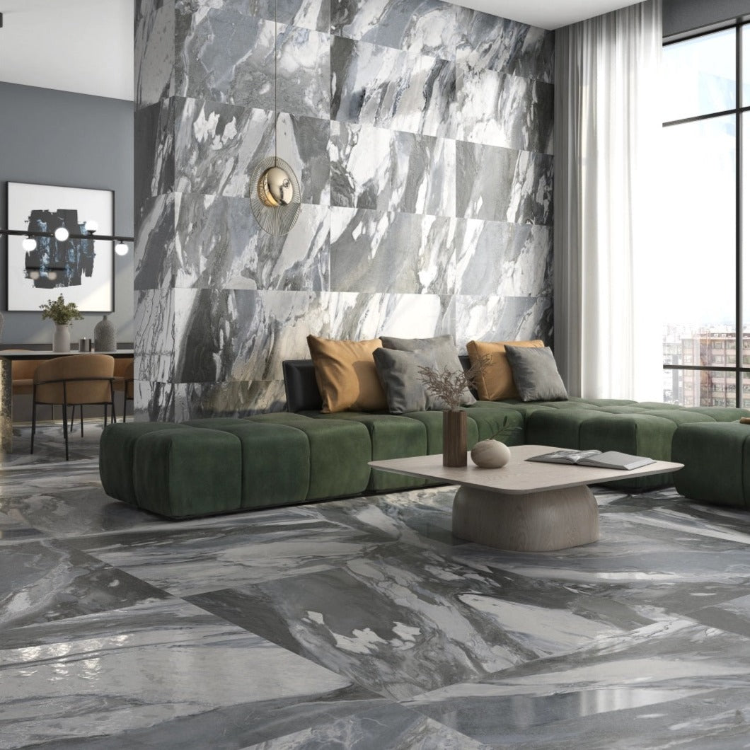 Lab Jeans Grigio porcelain tile with a white marble design, for floors and walls. Made in Spain, installed in a room.