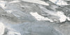 Lab Jeans Grigio porcelain tile with a white marble design, for floors and walls. Made in Spain, in a 24x48" size.