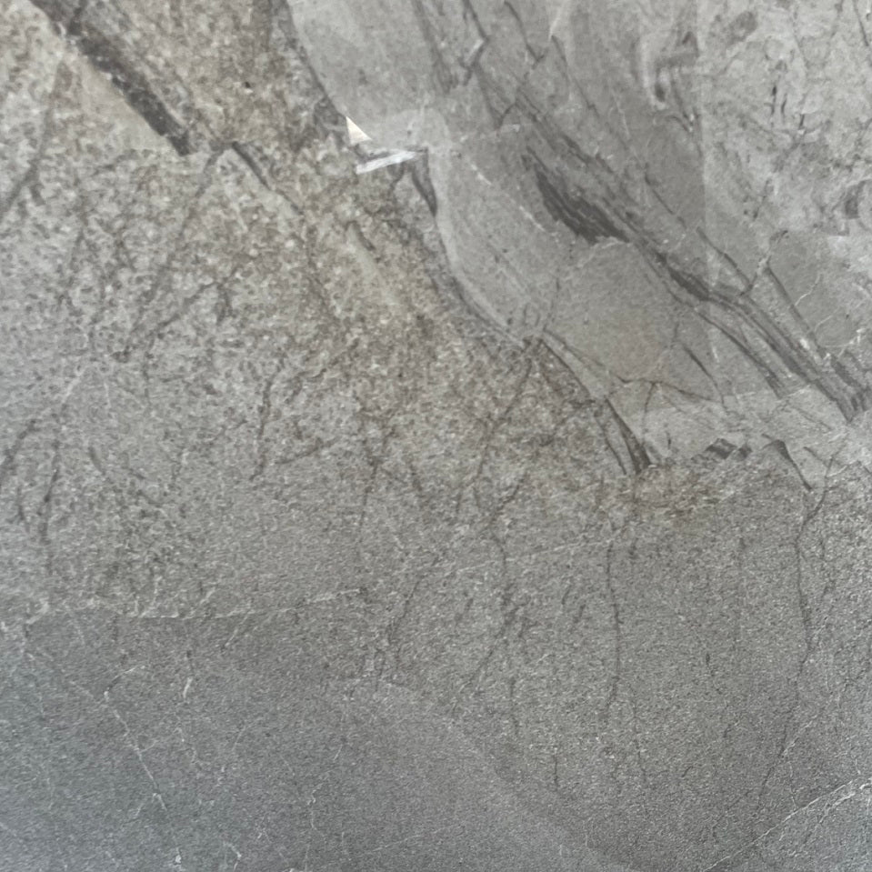 Lazio Silver polished porcelain tile with a stone design, for floors and walls. In a 24x24" size.