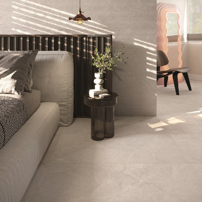 Legacy Stone Perla matte porcelain tile with a stone design, for floors and walls. Made in Italy, installed in a room.