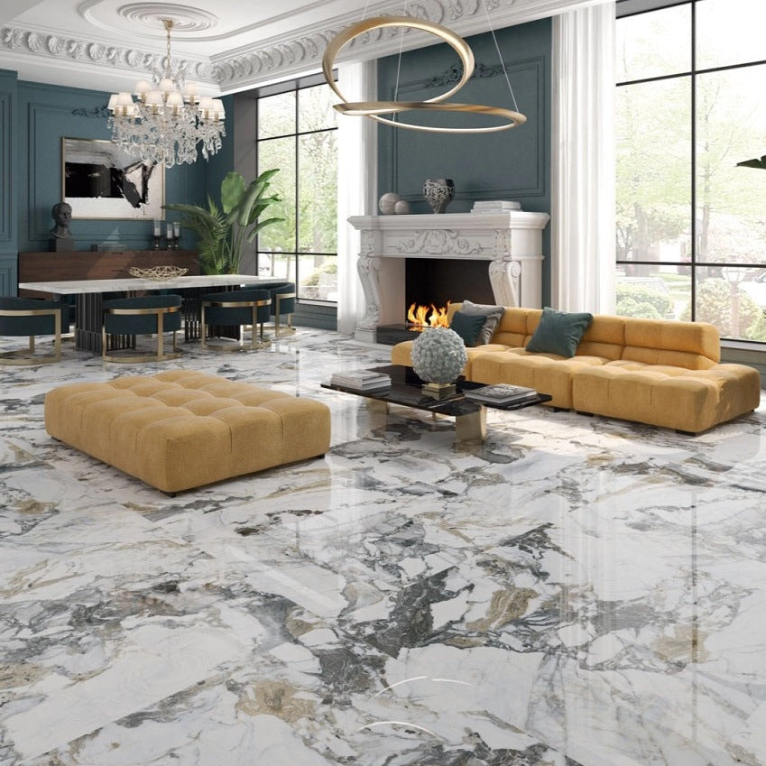 Liberty polished porcelain tile with a white, gold, and grey marble design, for floors and walls. Installed in a room.