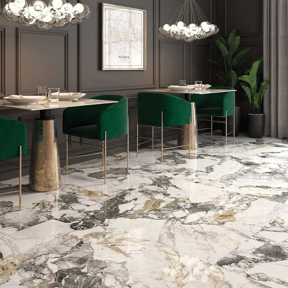 Liberty polished porcelain tile with a white, gold, and grey marble design, for floors and walls. Installed in a room.