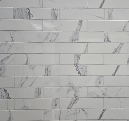 Calacata white marble style ceramic subway tile, for walls. Made in Spain, in a 3x12" size.
