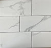Carrara white marble style ceramic subway tile, for walls. Made in Spain, in a 4x8" size.