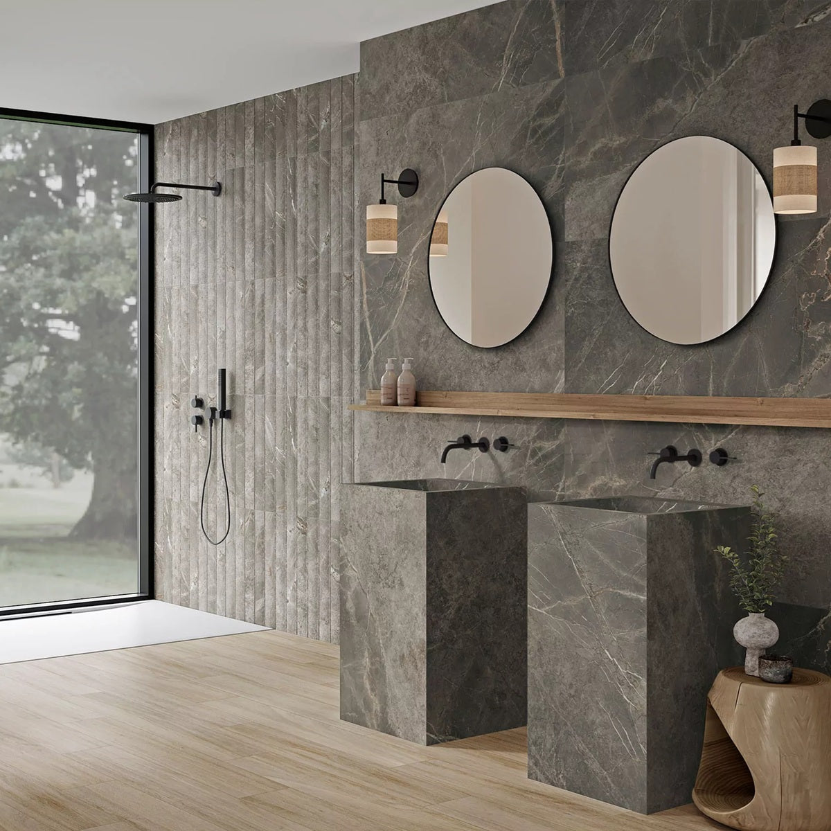 Marmi Grafito porcelain tile with a dark grey marble design, for floors and walls. Made in Spain, installed in a room.